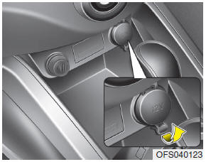 Hyundai Veloster: Power outlet. The power outlet is designed to provide power for mobile telephones or other