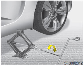 Hyundai Veloster: Changing tires. 9. Insert the jack handle into the jack and turn it clockwise, raising the vehicle