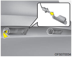 Hyundai Veloster: License plate light bulb replacement. 1. Open the tailgate.